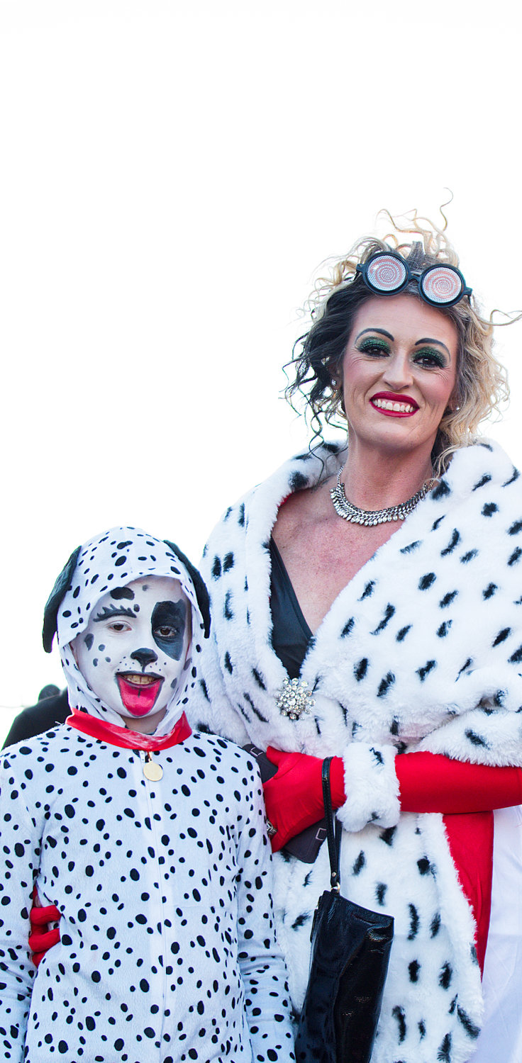 Cruella DeVille poses with one of her future furs in Downtown Mineola on Halloween.